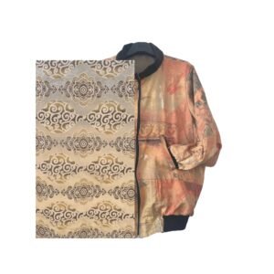 Champagne and beige with a repeating geometric pattern of cloud medallions in dark brown and gold — the design feels Tibetan, Mongolian, ancient and completely modern at the same time. Found at Kantamanto market in Accra. Sewn in Aburi, Ghana. One of one.
